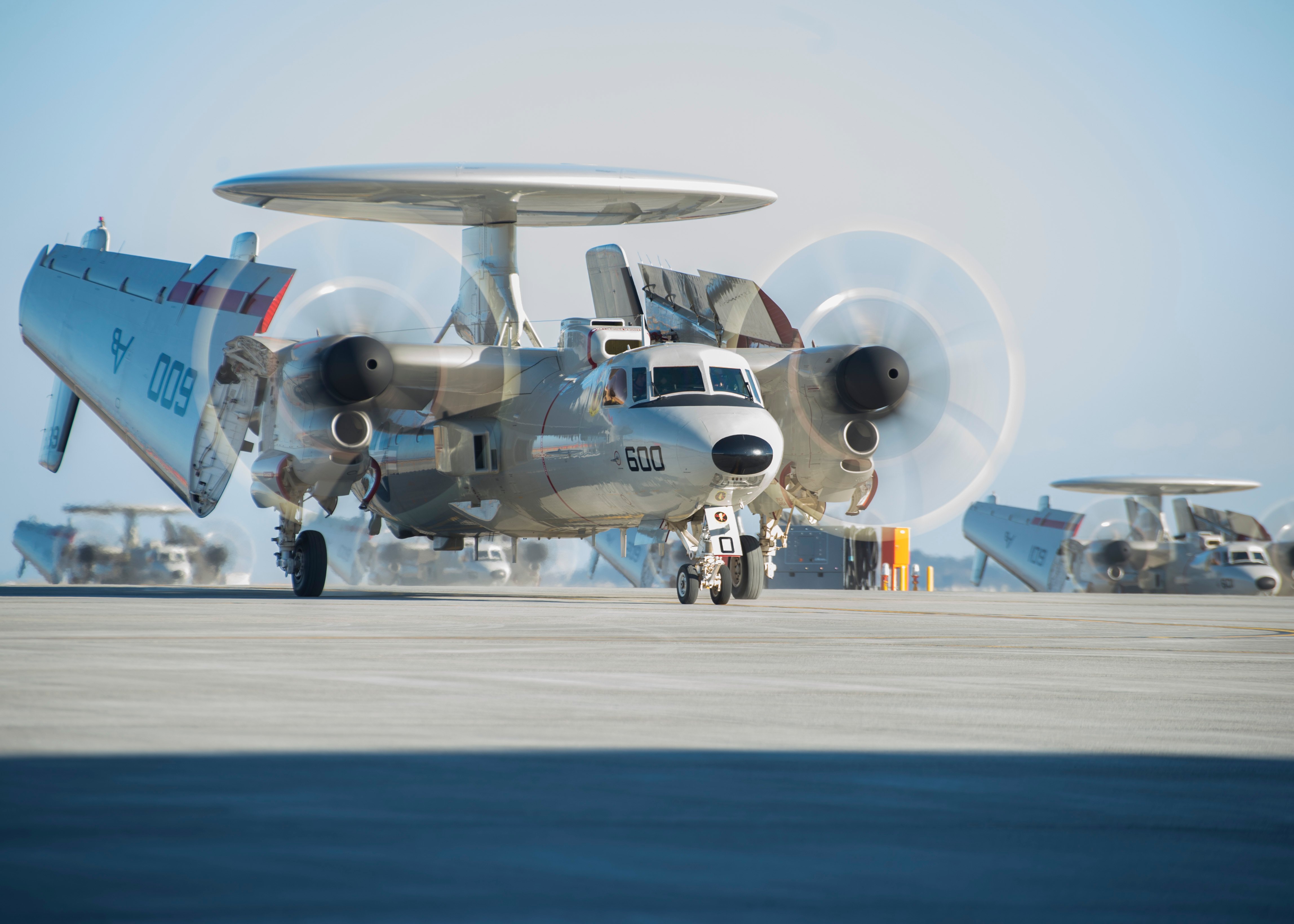 Five_E2-D_Advanced_Hawkeye_aircrafts_taxi_the_runway._(32544236571)