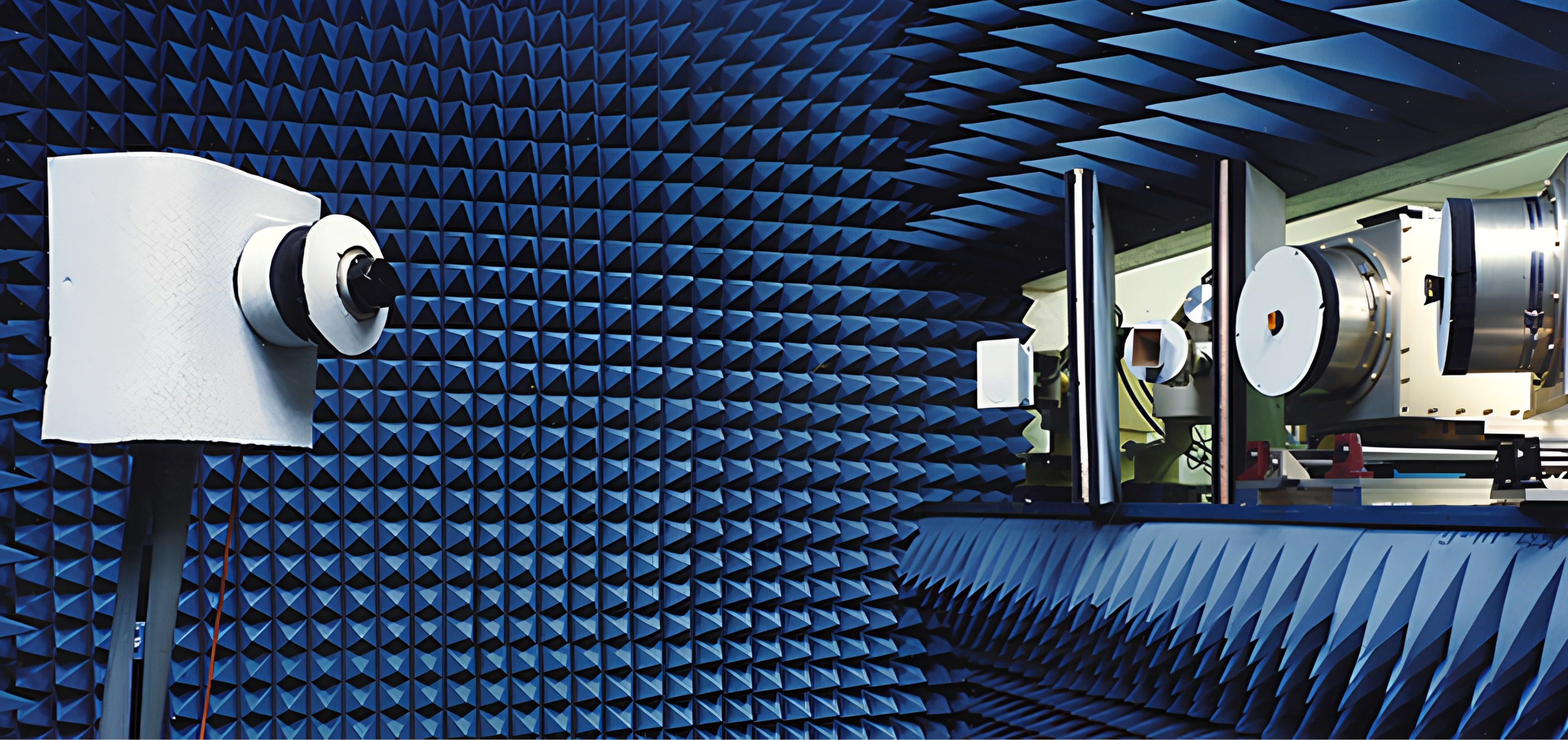 Testing anechoic chamber surrounded by foam with antennas on positioners