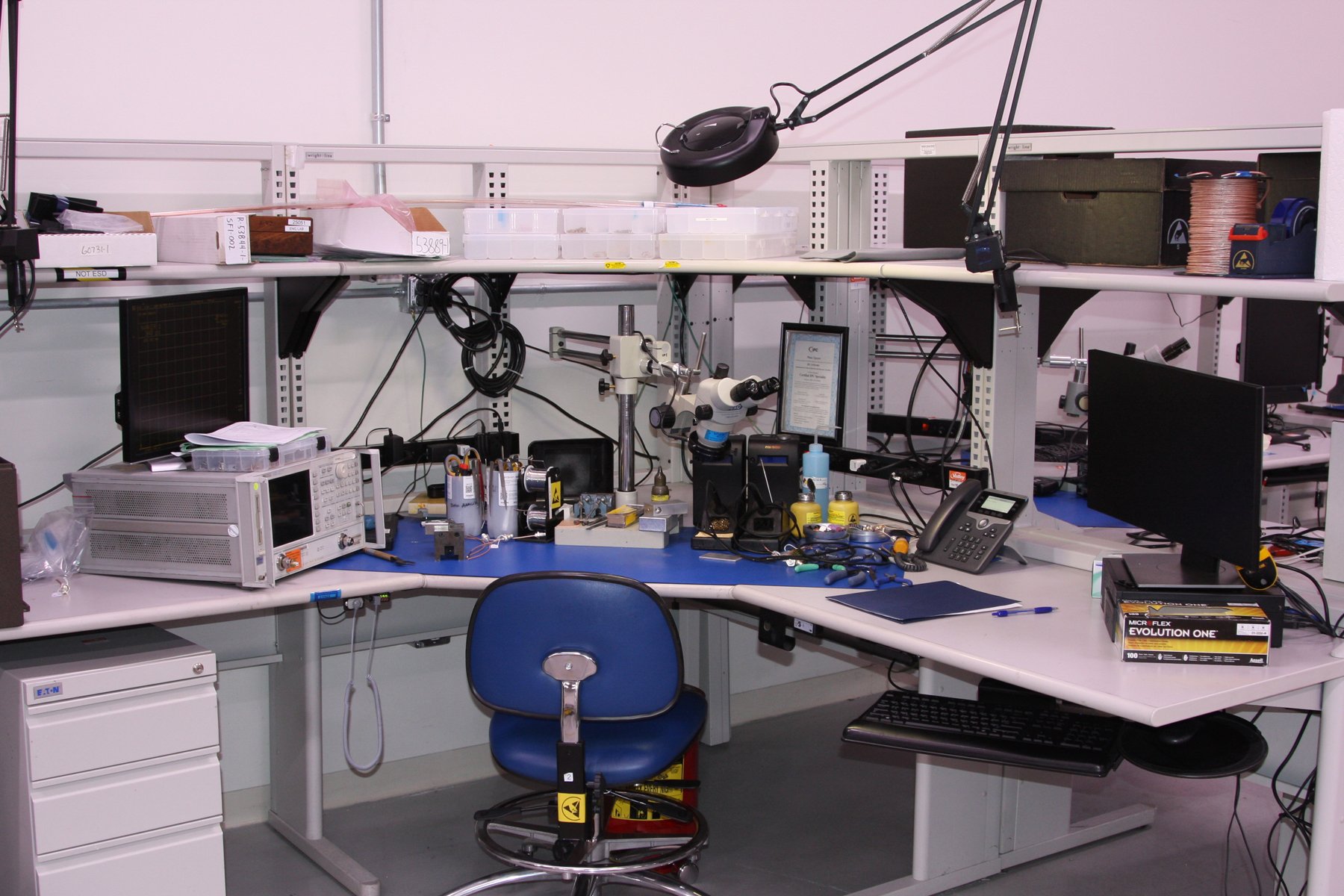 An office desk with measuring equipment surrounding the desk